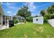 Spacious backyard with a grill and storage shed at 4059 Twinbush Ter, North Port, FL 34286