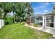 Green grassy backyard with pool and shed at 4059 Twinbush Ter, North Port, FL 34286