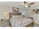 Main bedroom with king bed and ceiling fan at 4059 Twinbush Ter, North Port, FL 34286