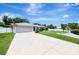 Single-story home with attached garage and landscaped yard at 4059 Twinbush Ter, North Port, FL 34286