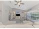 Bright living room with vaulted ceilings, sectional sofa and TV at 4059 Twinbush Ter, North Port, FL 34286