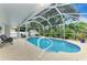 Inviting screened pool with a convenient pool ladder at 4059 Twinbush Ter, North Port, FL 34286