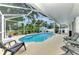 Relaxing screened pool area with patio furniture at 4059 Twinbush Ter, North Port, FL 34286