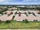 Aerial view of community, showing homes near lake at 4149 Cascade Falls Dr, Sarasota, FL 34243