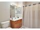 Bathroom with shower/tub combo and wood vanity at 4149 Cascade Falls Dr, Sarasota, FL 34243