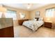 Bedroom with neutral color scheme, tile floor, a ceiling fan and dresser at 4355 Boggs St, Port Charlotte, FL 33948