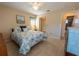 Bright bedroom with tile flooring, neutral walls, and view of ensuite bathroom at 4355 Boggs St, Port Charlotte, FL 33948