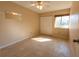 Clean bedroom featuring tiled floors, a closet, and bright natural light at 4355 Boggs St, Port Charlotte, FL 33948