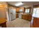 Well-organized kitchen featuring tiled floors, modern appliances, and ample cabinetry at 4355 Boggs St, Port Charlotte, FL 33948