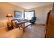 Cozy living room featuring tiled floors, neutral walls, and comfortable seating at 4355 Boggs St, Port Charlotte, FL 33948