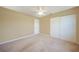 Spacious bedroom with ceiling fan and double closets at 4415 Mundella Cir, Port Charlotte, FL 33948