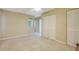 Bedroom with double door closet and access to bathroom at 4415 Mundella Cir, Port Charlotte, FL 33948