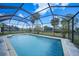 Inviting screened pool with a spacious backyard at 4415 Mundella Cir, Port Charlotte, FL 33948