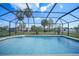 Inviting screened pool with a spacious backyard at 4415 Mundella Cir, Port Charlotte, FL 33948