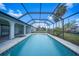 Inviting screened pool with a spacious backyard at 4415 Mundella Cir, Port Charlotte, FL 33948