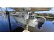 A closer view of the boat lift with a boat at 4542 Fallon Cir, Port Charlotte, FL 33948