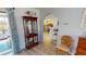 Hallway area transitioning to dining room and kitchen with nautical decor and hardwood floors at 4542 Fallon Cir, Port Charlotte, FL 33948