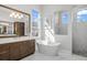 Luxurious bathroom with soaking tub and walk-in shower at 500 Blue Shell Loop, Sarasota, FL 34240