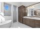 Spa-like bathroom with soaking tub and walk-in shower at 500 Blue Shell Loop, Sarasota, FL 34240