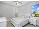 Serene bedroom featuring a white bed frame and natural light at 500 Blue Shell Loop, Sarasota, FL 34240