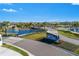 Community entrance with a sign and landscaping at 500 Blue Shell Loop, Sarasota, FL 34240