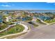 Wide shot of community entrance and landscaping at 500 Blue Shell Loop, Sarasota, FL 34240