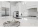 Spacious kitchen featuring stainless steel appliances and white cabinetry at 500 Blue Shell Loop, Sarasota, FL 34240