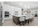 Modern kitchen with white cabinets, a large island, and stainless steel appliances at 500 Blue Shell Loop, Sarasota, FL 34240