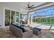 Outdoor kitchen and lanai with seating area, perfect for entertaining at 500 Blue Shell Loop, Sarasota, FL 34240