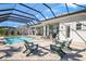 Screened pool and spa with plenty of seating for relaxation at 500 Blue Shell Loop, Sarasota, FL 34240