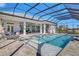 Large pool and spa with screened enclosure, offering ultimate privacy at 500 Blue Shell Loop, Sarasota, FL 34240