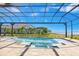 Stunning pool and spa with a screened enclosure and water views at 500 Blue Shell Loop, Sarasota, FL 34240