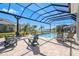 Enjoy this relaxing pool and spa with a screened enclosure at 500 Blue Shell Loop, Sarasota, FL 34240