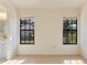 Sunlit bedroom featuring a large window and view to the outside at 5688 Mashie Cir, North Port, FL 34287