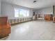 Under renovation, this living room features terrazzo floors and large windows at 625 Pompano Ter, Punta Gorda, FL 33950