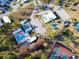 An aerial view of the community pool, tennis courts, and clubhouse at 6835 Anapa Ct, North Port, FL 34287