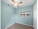 Clean bedroom has minimalist decor, a ceiling fan, and a window to let in natural light at 6835 Anapa Ct, North Port, FL 34287