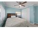 This bedroom features wood-look flooring, closet, and lots of natural light at 6835 Anapa Ct, North Port, FL 34287