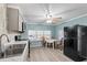 Bright kitchen area with modern appliances and table with four chairs near window at 6835 Anapa Ct, North Port, FL 34287