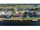 Aerial view shows home's location near golf course and canal at 716 Monaco Dr, Punta Gorda, FL 33950