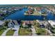 Aerial view of canal-front home with lush landscaping at 716 Monaco Dr, Punta Gorda, FL 33950