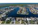 Wide aerial showcasing the home's canal-side location at 716 Monaco Dr, Punta Gorda, FL 33950