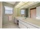 Clean bathroom, featuring a large vanity with mirror and shower at 716 Monaco Dr, Punta Gorda, FL 33950