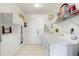 Laundry room with washer, dryer, and ample storage shelving at 716 Monaco Dr, Punta Gorda, FL 33950