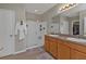 Bathroom featuring a double sink vanity and a glass-enclosed shower at 7325 Mikasa Dr, Punta Gorda, FL 33950