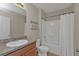 Bright bathroom featuring a shower-tub combo and a sink at 7325 Mikasa Dr, Punta Gorda, FL 33950