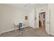 Bedroom with carpeted floors and a door leading to another room at 7325 Mikasa Dr, Punta Gorda, FL 33950