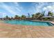 Large community pool with ample seating and shade for residents to enjoy at 7325 Mikasa Dr, Punta Gorda, FL 33950