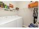 Laundry room with a washer and dryer, and a shelf above at 7325 Mikasa Dr, Punta Gorda, FL 33950