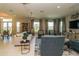 Well-lit living room featuring plush seating, neutral colors, and ample natural light at 7325 Mikasa Dr, Punta Gorda, FL 33950